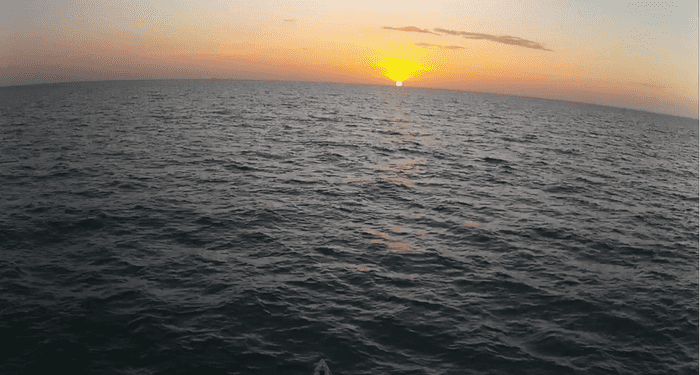 Heading East, sail down, sunrise, mast camera